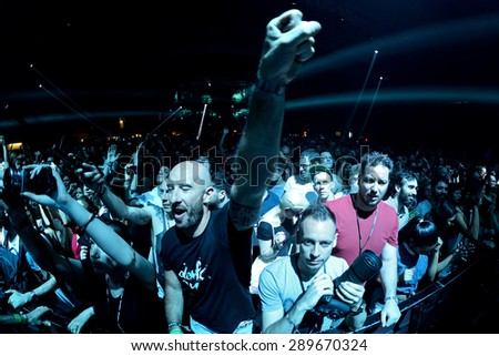 BARCELONA - JUN 20: People from the first row watch a concert at Sonar Festival on June 20, 2015 in Barcelona, Spain.
