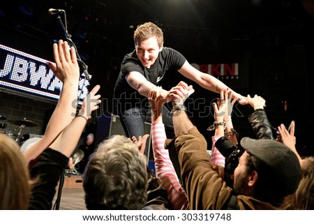 BARCELONA - MAR 18: The frontman of The Subways (rock band) performs with the crowd at Bikini stage on March 18, 2015 in Barcelona, Spain.