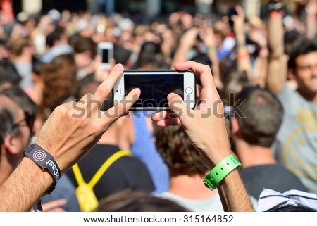 BARCELONA - JUN 18: A man takes a picture with his smartphone  in a concert at Sonar Festival on June 18, 2015 in Barcelona, Spain.