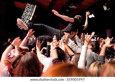 BARCELONA - MAR 18: The singer of The Subways (rock band) performs with the crowd at Bikini stage on March 18, 2015 in Barcelona, Spain.