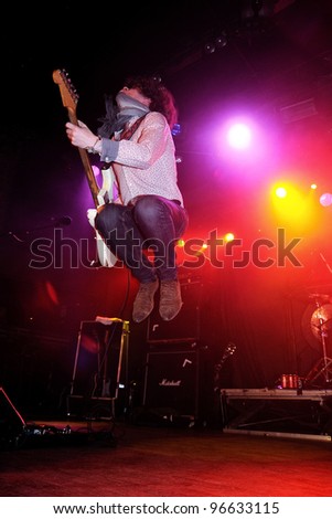 BARCELONA, SPAIN - MAR 01: Jason Barwick, guitarist and lead singer of the british rock/blues band The Brew, jumps at Bikini on March 1, 2012 in Barcelona, Spain.