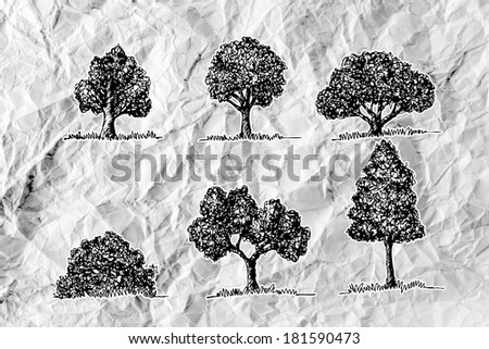 Set of trees with leaves on crumpled paper