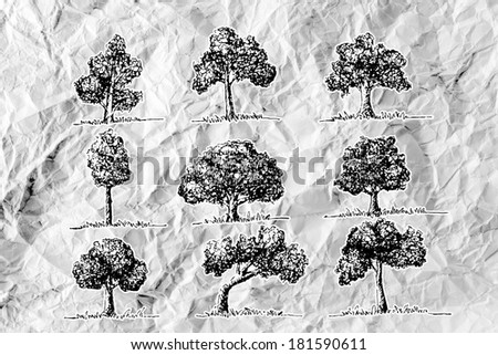 Set of trees with leaves on crumpled paper