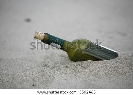 message bottle in the sand