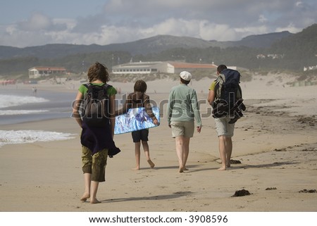 people walking on beach. stock photo : people walking