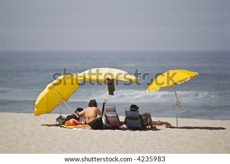 couple in the shadow a yellow umbrella