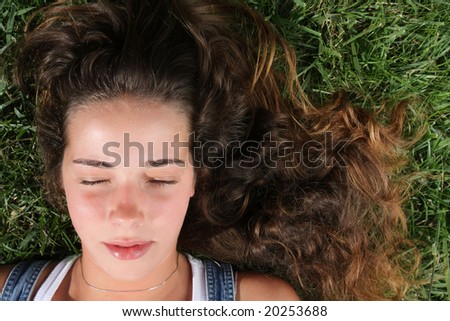 sweet woman rests on the grass