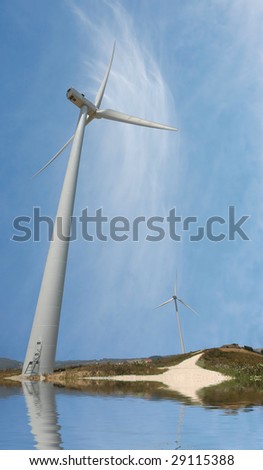 photo of a road with wind turbines