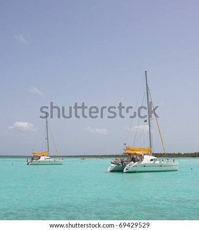 catamarana and people swiming in caribbean sea