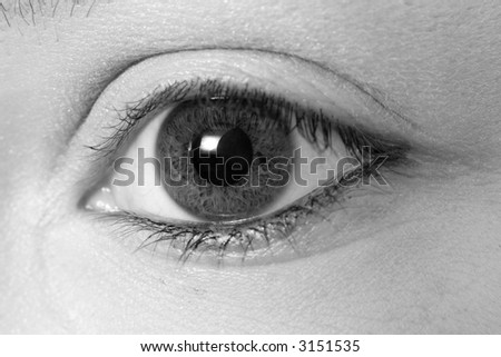 A black and white picture of a girls eye
