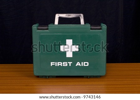 A green first aid kit