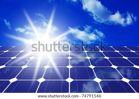Image of solar panels - clean energy source on the background of sky and bright sun
