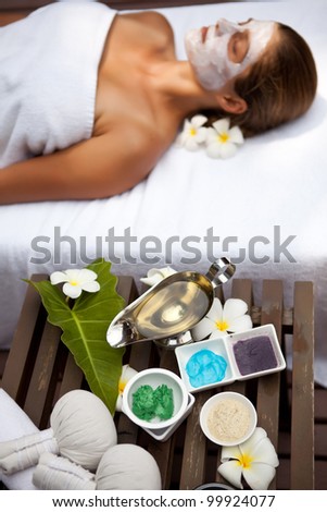 Young beautiful woman in tropical spa