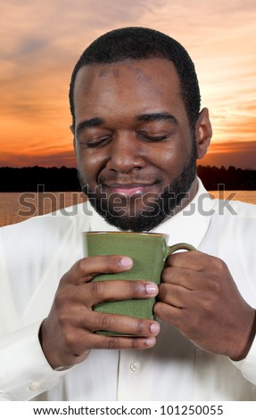 stock-photo-young-black-african-american-man-drinking-coffee-101250055.jpg