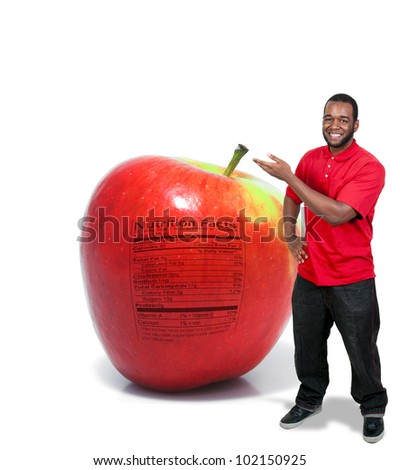 A handsome young man with an apple with a nutrition label