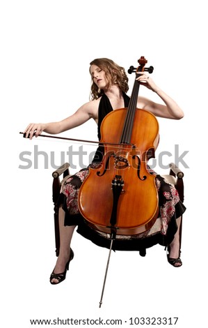 Beautiful woman cellist with her cello musical instrument