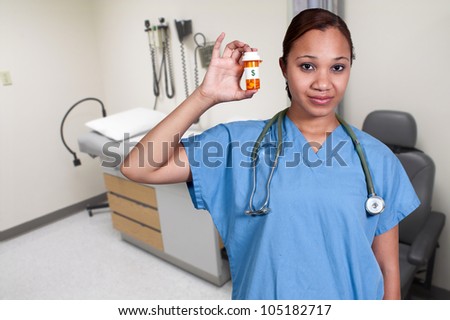 Black woman doctor holding a bottle of prescription pills in a bottle