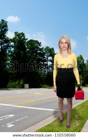 Beautiful woman with gas can out of gas