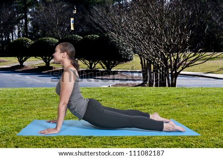 Beautiful black African American woman doing her Yoga exercises