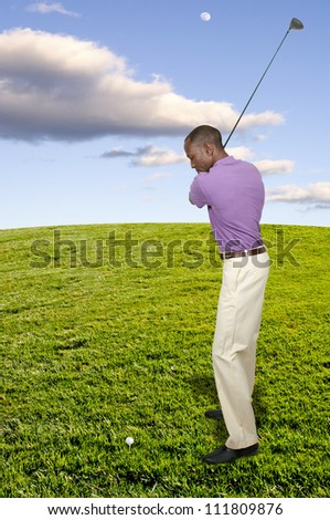 Handsome man playing a round of the sport known as golf