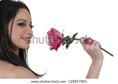 Beautiful woman holding a fresh cut rose