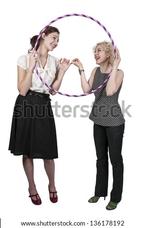 Couple of beautiful young women who are the best of friends with a hula hoop
