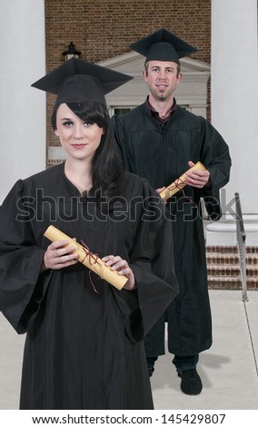 Young man and woman in their graduation robes