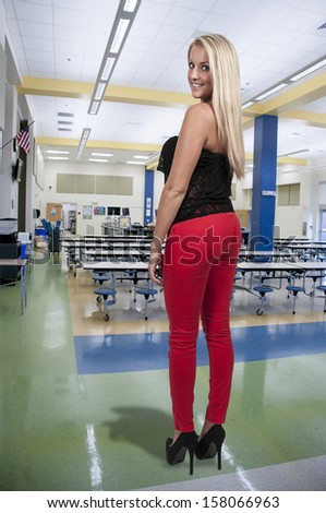 Beautiful woman ordering food at a cafeteria