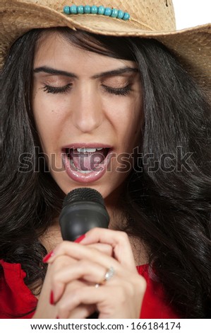 Beautiful woman singer performing at a concert