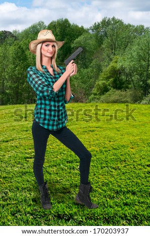 Beautiful police detective woman on the job with a gun