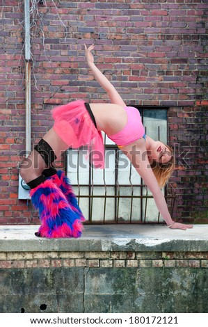 Beautiful woman involved in acrobatic exercise activity