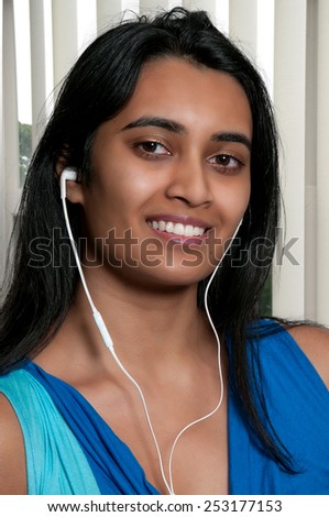 Woman using ear buds to listen to her music
