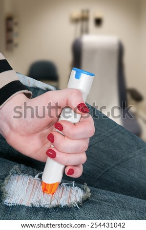 Woman injecting emergency medicine into her leg