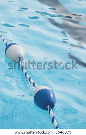 A buoy and rope swimming pool lane marker.