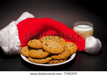 A plate of cookies and a glass of milk left out for Santa Claus