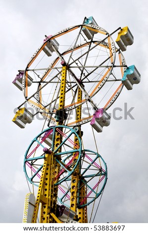A large ferris wheel or big wheel at a fair.