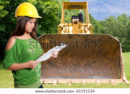 A Hispanic Woman Construction Worker on a job site.