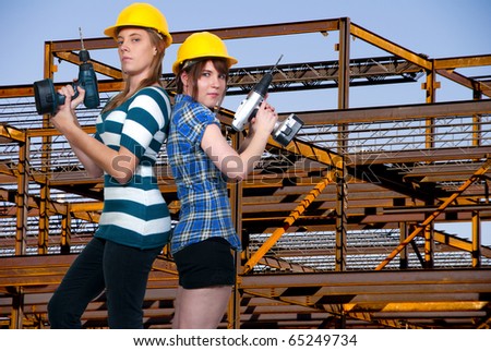 A couple of Women Construction Workers on a job site.