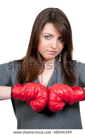A beautiful young woman wearing a pair of boxing gloves