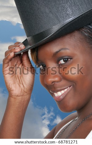 A beautiful young actress dancer wearing a top hat