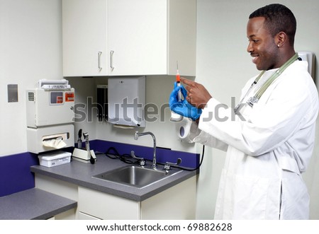 An black man African American doctor holding a syringe