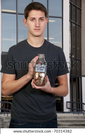 A young man holding a jar of money coins labeled retirement account