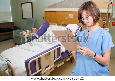 A beautiful young female Asian doctor on her rounds