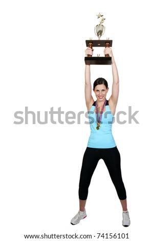 A beautiful woman wearing medals holding a large trophy