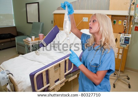 A beautiful young woman doctor holding an IV bag