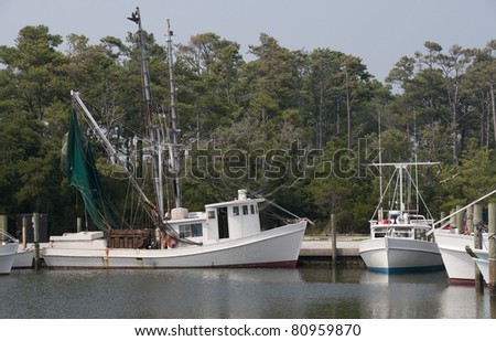 A commercial shrimp boat docked at the ocean