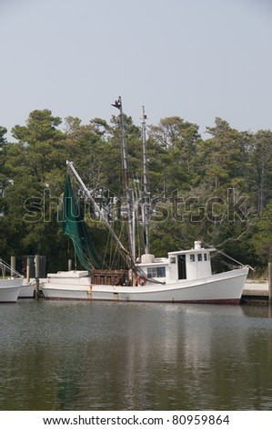 A commercial shrimp boat docked at the ocean