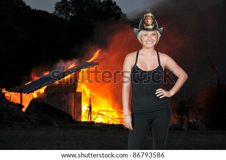 A beautiful woman firefighter at a fire