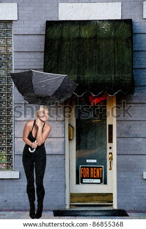 A beautiful woman holding a colorful umbrella in the wind