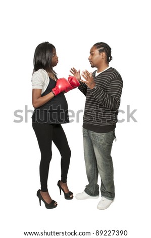 stock photo Beautiful young black pregnant woman wearing a boxing glove